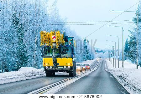 Lorry With Lifting Crane On Road In Winter Rovaniemi