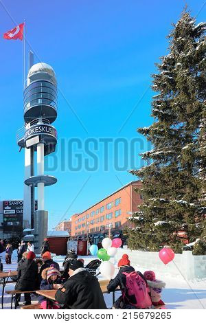 People Celebrating Holiday In Lordi Square In Winter Rovaniemi