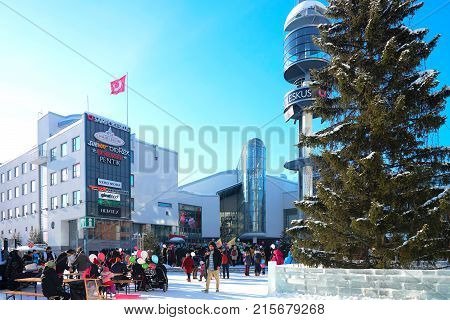 People Celebrating Holiday At Lordi Square In Winter Rovaniemi