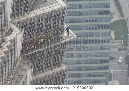 Shanghai, China - Nov 10, 2017: People walking on glass walkway at the Jinmao Tower in Shanghai