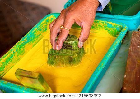 Close up stamp and bright yellow dye for cloth