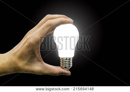 hand holding glowing polygonal lamp on background black. Innovative ideas concept. Bright idea. the way to solve problem Good solution.. business finance.
