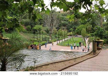 Park And Muslim People Walking In It
