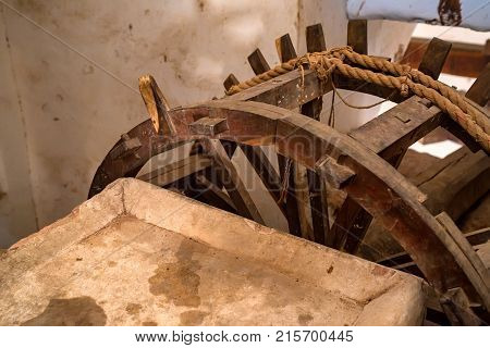 Close up wooden wheel part of watre supply system in historical Amer Fort in India