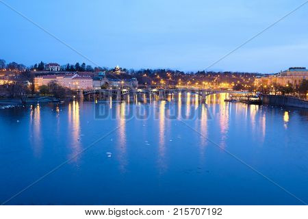 Prague, Czech Republic - November, 23, 2017: night view from the Charles bridge to the Vitava embankment in the center of Prague