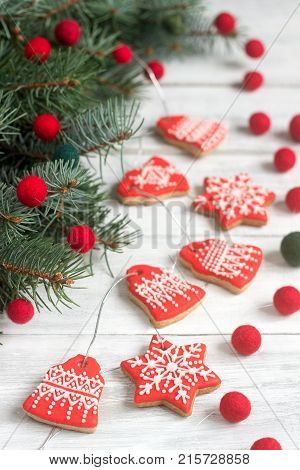 Gingerbread Bells, Stars, Garland Of Felted Beads And Fir Branches On A Light Background Christmas O