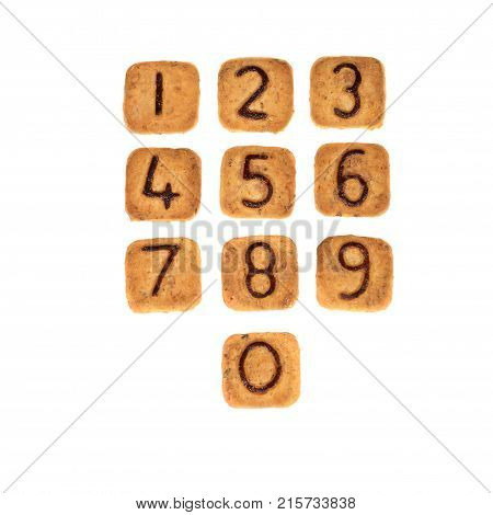 Square Cookies With Chocolate Numerals On Them Isolated On White Background. Figures From Zero To Ni