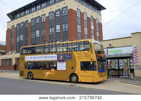 Bracknell, England - Nov 22, 2017: A Reading Double Decker Bus stops to pick up passengers at a bus stop in Bracknell, England