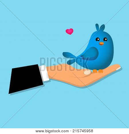 Cute blue bird sitting on a male hand. Cute bird toy or animal presenting