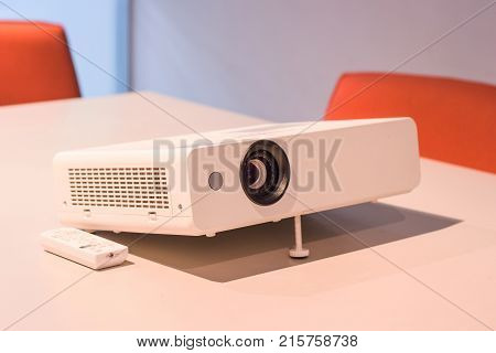 projector for presentation in a meeting room, (Light in a light yellow tone room.)
