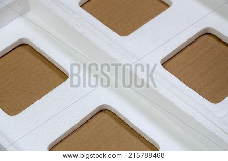 Background Image With Beige Cardboard Paper And Styrofoam Boxes Disgarded As Rubbish. The Concept Of