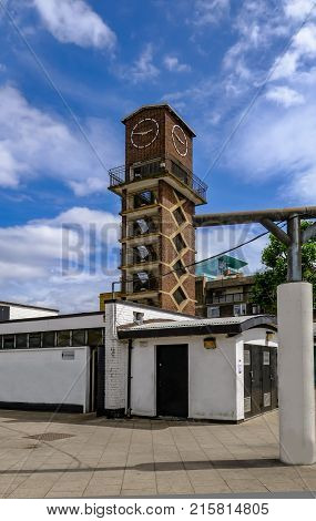 Clock tower at Chrisp Street Market in the East End of London. Portriat shot of this historic building.
