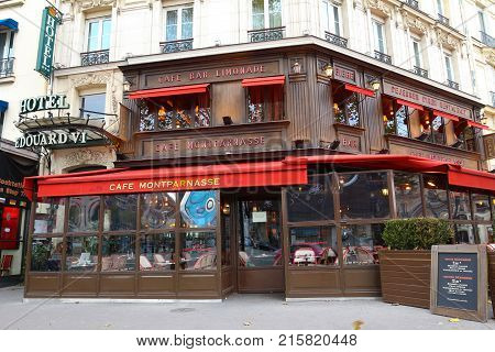 PARIS, France - November 26, 2017: View of typical Parisian cafe Montparnass on November 26, 2017 . It is located on famous Montparnass boulevard in Paris, France.