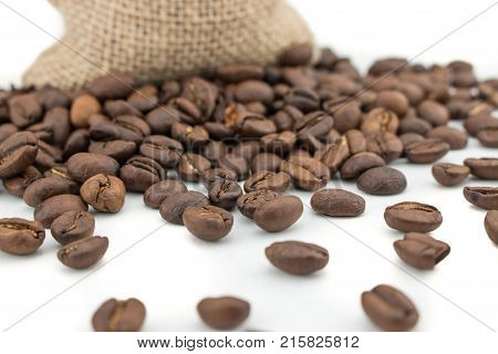 Coffee beans on sack background. Isolated coffee bag on white background. Coffee beans isolated.