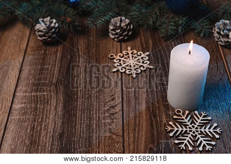 Christmas Candle On A Wooden Background