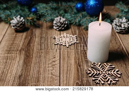 Christmas Candle On A Wooden Background