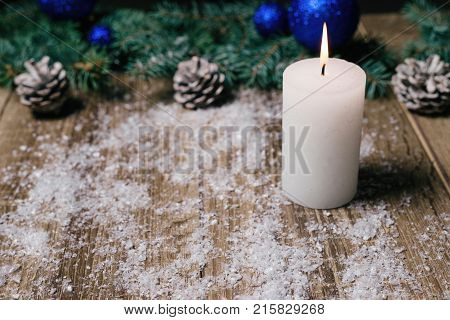 Christmas Candle On A Wooden Background