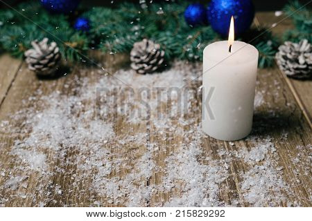 Christmas Candle On A Wooden Background