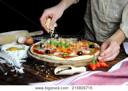 girl homemade pizza in the kitchen