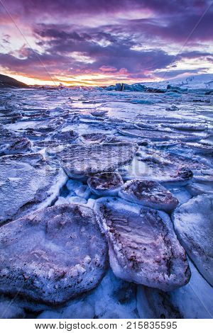Icebergs in Jokulsarlon glacial lake during sunset, Iceland, Europe.