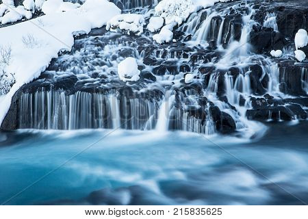 Hraunfossar waterfall in winter. One of the most popular waterfall in Iceland, Europe.