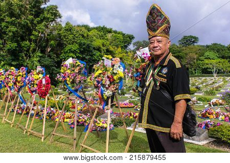 Labuan,Malaysia-Nov 12,2017:Kadazandusun man in traditional Kadazandusun costumes attending the Remembrance Day Lest We Forget at Commonwealth World War II graveyard in Labuan,Malaysia.