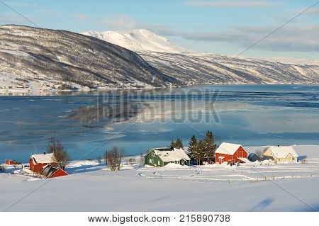 Winter view to Lavangen fjord and Soloy village in Troms county, Norway.