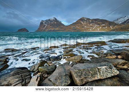 Rocky coast of fjord of Norwegian sea in winter. Lofoten islands, Norway