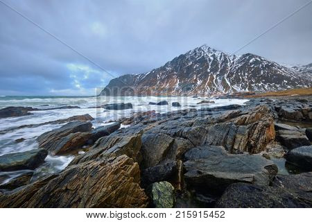 Rocky coast of fjord of Norwegian sea in winter. Lofoten islands, Norway