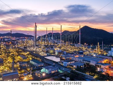 Aerial view Oil refinery.Industrial view at oil refinery plant form industry zone with sunrise and cloudy sky.Oil refinery and Petrochemical plant at duskThailand. Oil refinery background sunset.