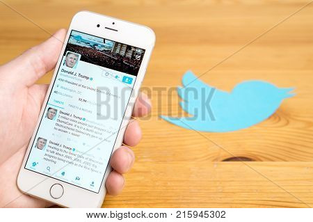 JYVASKYLA FINLAND - JUNE 13 2017: The official Twitter account of Donald Trump on mobile and printed logo. The American President has over 32 million followers on Twitter. Illustrative editorial.