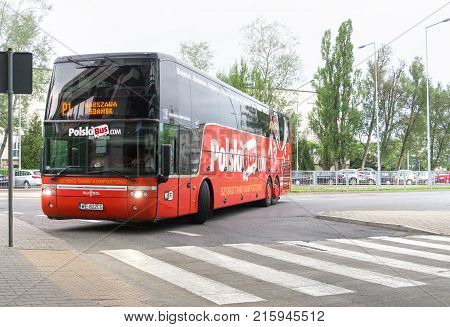 WARSAW POLAND - MAY 25 2017: Bus approaching station in Warsaw. Polski Bus is a Polish express coach operator based in 2011.