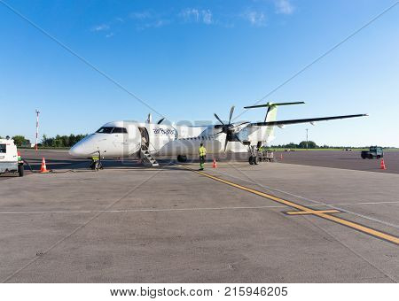RIGA LATVIA - AUGUST 27 2016: AirBaltic airplane after landing in the airport of Riga. Airbaltic is a latvian low-cost carrier and airline. Editorial.