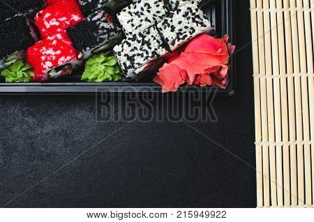 Sushi In A Black Container On A Wooden Table Colorful And Beautiful