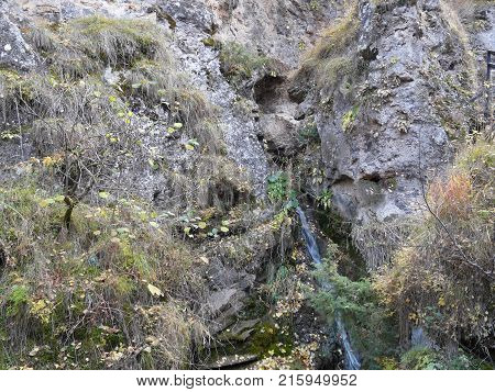 Mountain Caucasian river surrounded by picturesque autumn nature