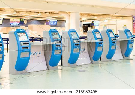 HELSINKI FINLAND - AUGUST 17 2017: Self service check-in machines in Helsinki-Vantaa Airport terminal. Editorial.