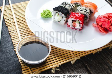 On The Plate Is White, Lined With Different Rolls, Sushi