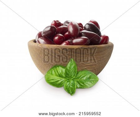 Cornels isolated on a white background. Cornels in a bowl with copy space for text. Ripe cornel close-up. Background berry.