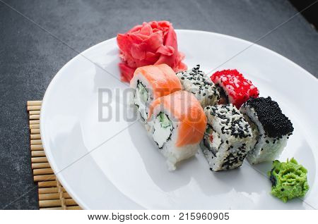 On The Plate Is White, Lined With Different Rolls, Sushi
