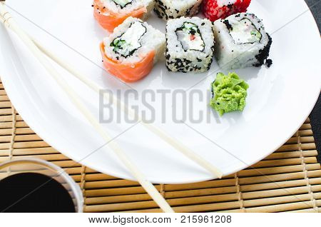 On The Plate Is White, Lined With Different Rolls, Sushi