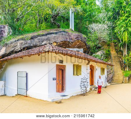KETAWALA SRI LANKA - DECEMBER 1 2016: The Image House of Bogoda Temple is built under the giant rock in jungle forest on December 1 in Ketawala.
