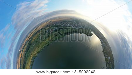 Drone Aerial 360 Degree Panoramic Curved View On Touristic City Located On Spit Between Sea And Lake