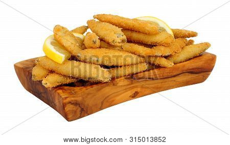 Fried Bread Crumb Covered Whitebait Fish In An Olive Wood Dish Isolated On A White Background