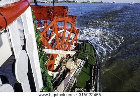 New Orleans, Usa - Dec 11, 2017: The Red Wooden Paddle-wheel Of The Historic Steamboat Natchez. On T