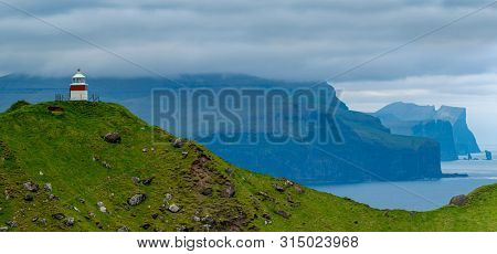 Shot Of Beautiful Panoramic Scene, Kalsoy Island and Kallur lighthouse, Faroe Islands