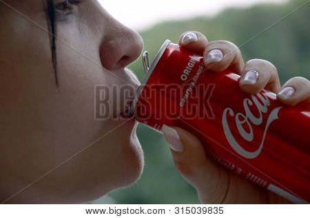 Caucasian Woman Drinking Coca Cola Bottle Red Tin Can 250ml