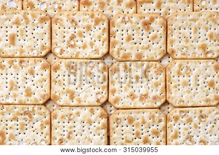 Tuc Original Snack Crackers Lies On Market Table Stacked In Big Pile