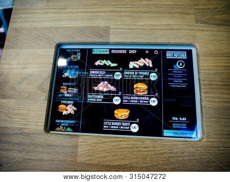 Strasbourg, France - Jun 28, 2018: Digital Screen Of Burger Restaurant Pub Menu - Brut Butcher Offer