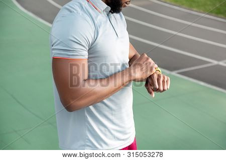 African American Male Athlete With A Fitbit Tracker