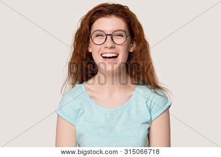 Headshot Portrait Funny Woman In Glasses Laughing On Grey Background